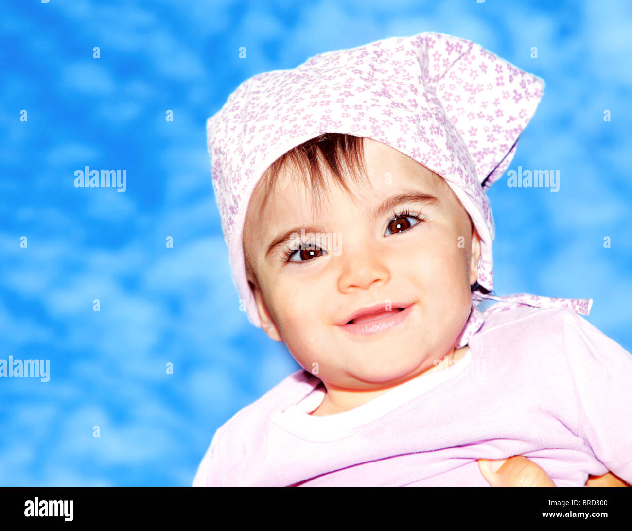 Little girl closeup portrait over blue sky Stock Photo - Alamy
