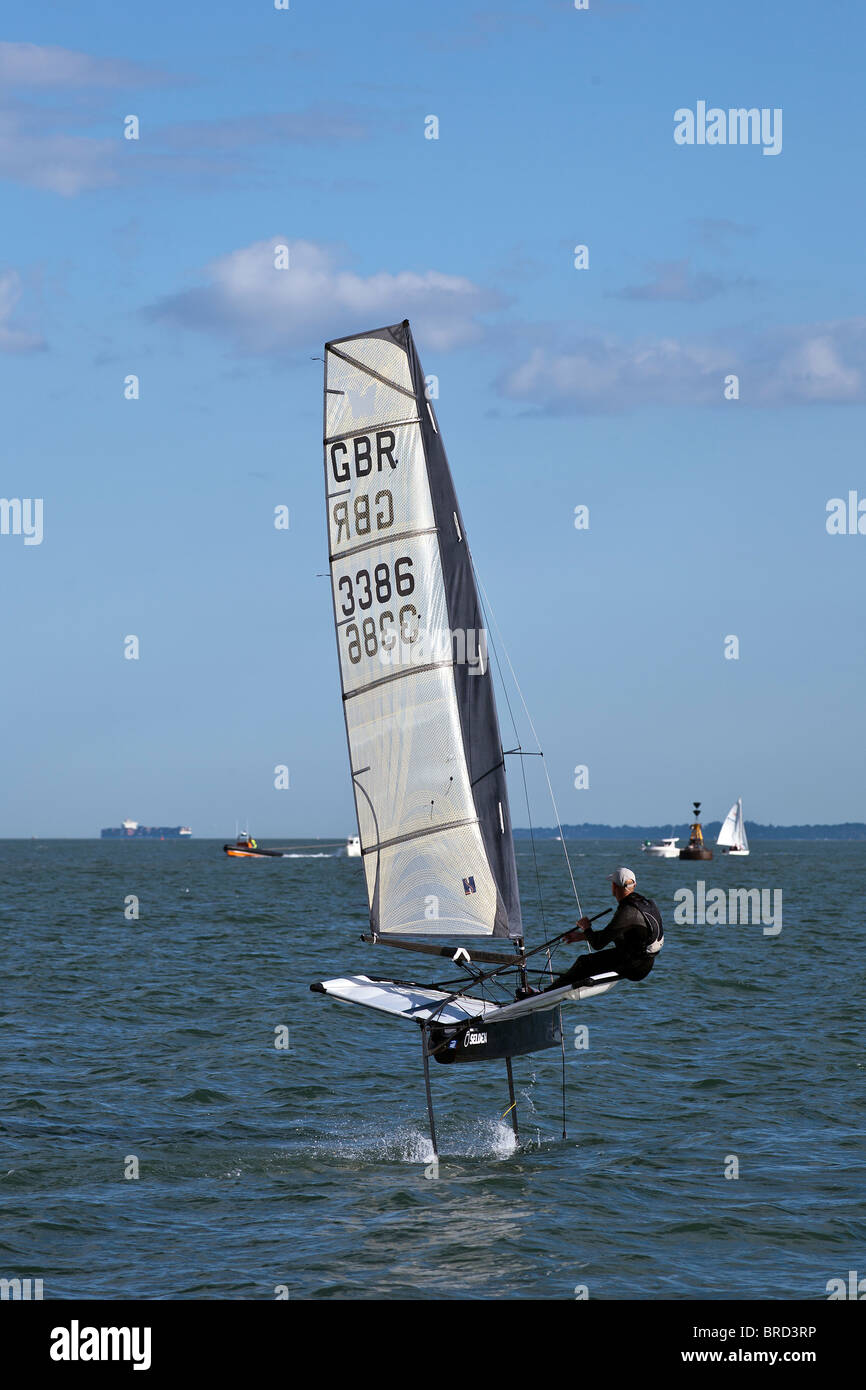 Foiling Sailing Dinghy Hydrofoil Moth Fast Speed in 10kts of wind Stock