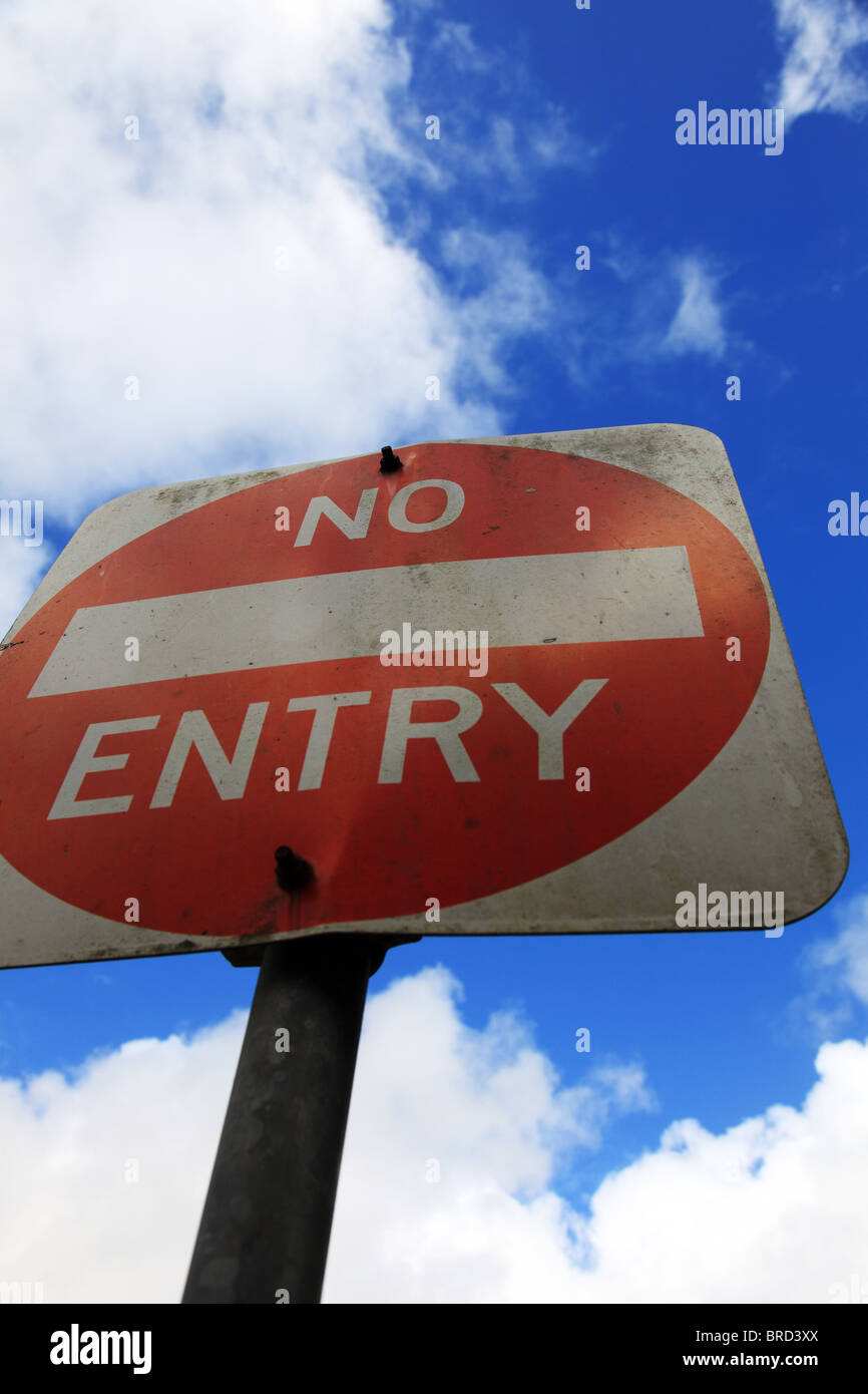 No entry sign in front of light cloudy sky. Stock Photo
