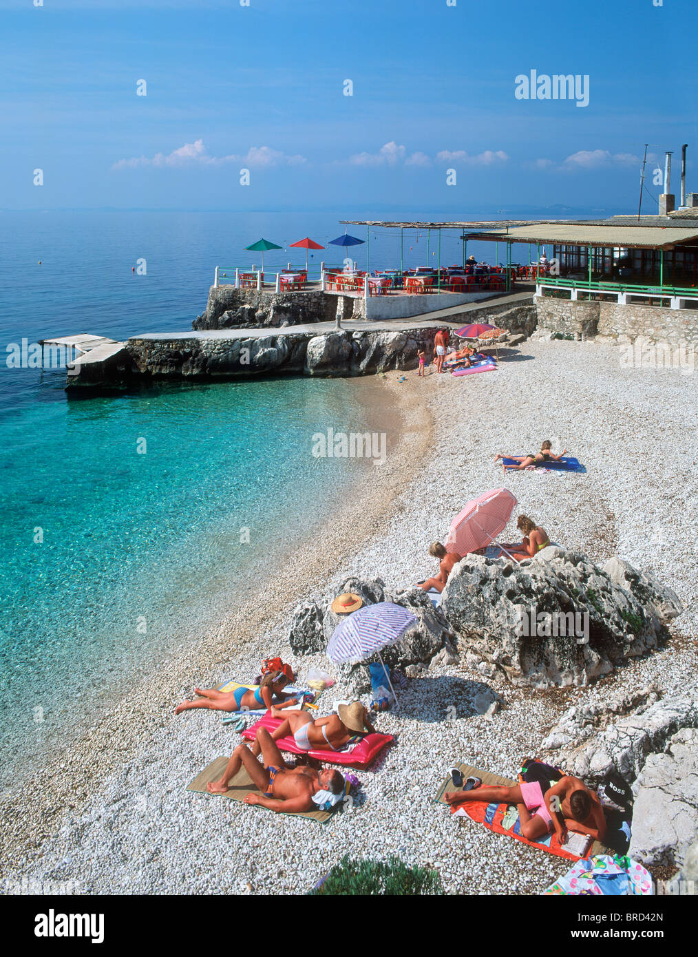 Taverna on small beach near Nissaki, Corfu (Kerkyra), Ionian Islands, Greece Stock Photo