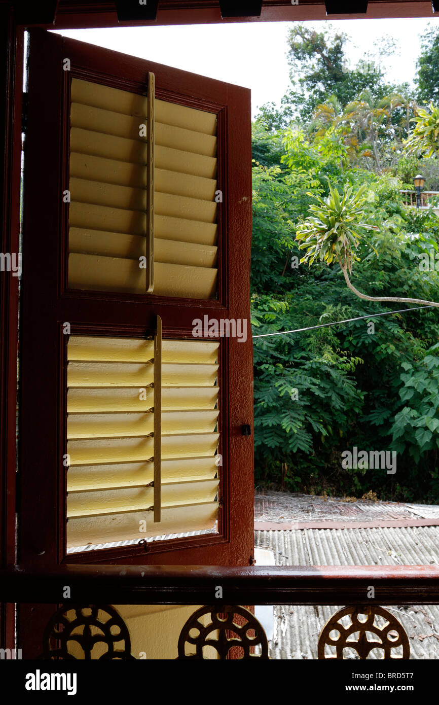 Old window shutter in a traditional Malay house - Malaysia. Stock Photo