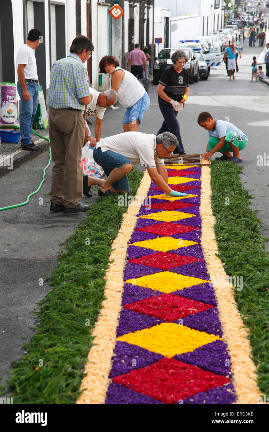 People making flower carpets for the Senhor Bom Jesus da Pedra fest. Vila Franca do Campo, Azores islands, Portugal. Stock Photo