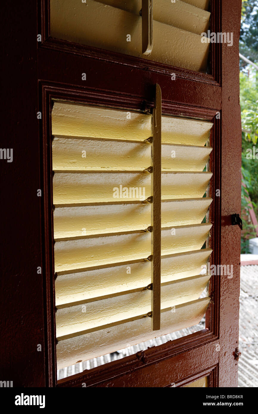 Old window shutter in a traditional Malay house Malaysia Stock Photo