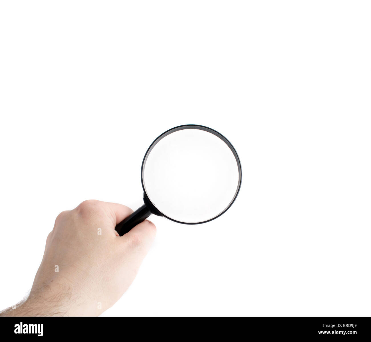 A human hand holding a magnifier to check something. All isolated on white background. Stock Photo