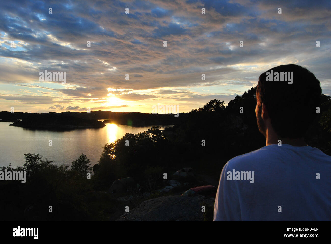 Looking Sunset man looking at the sunset Stock Photo - Alamy