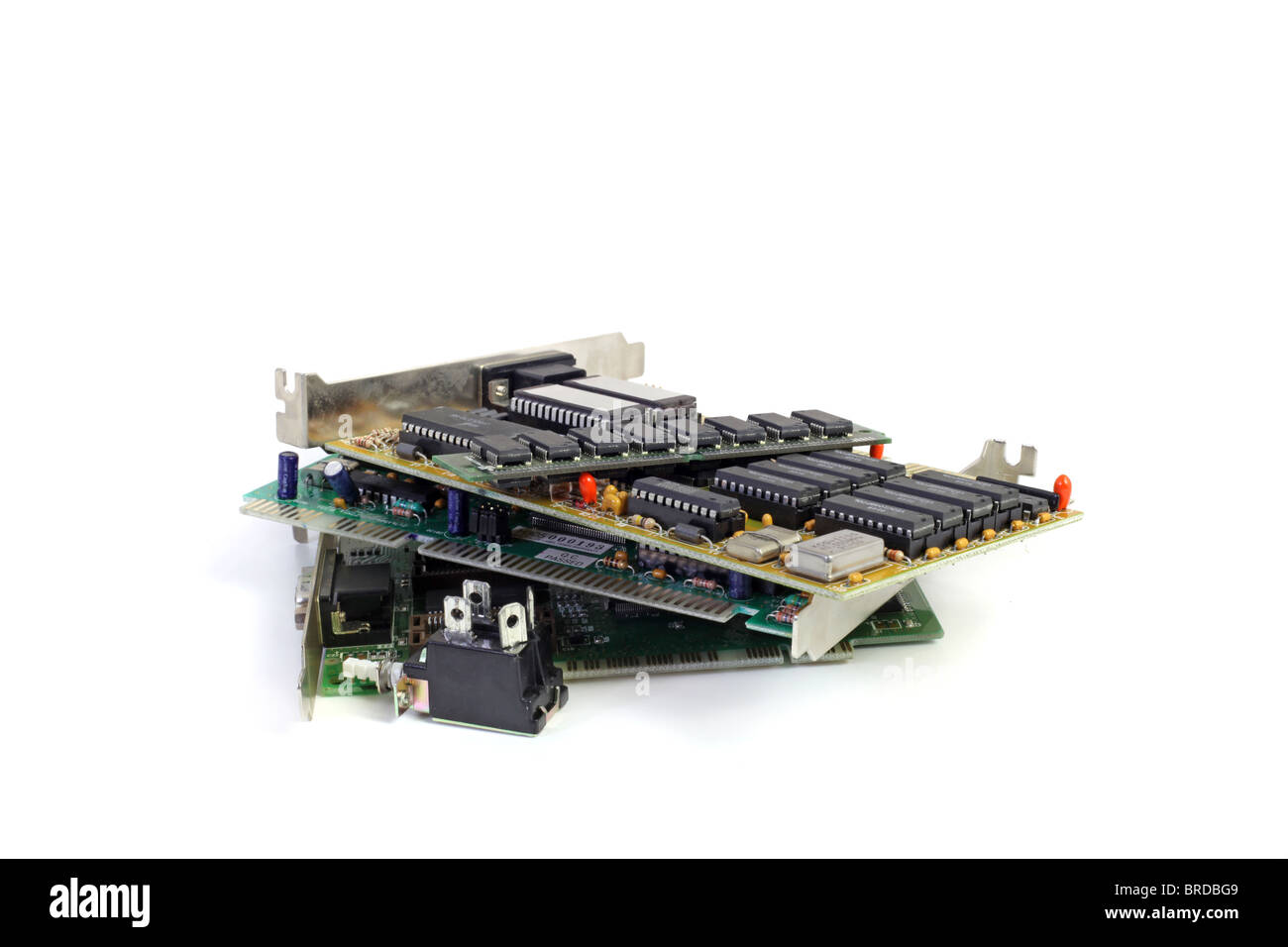 Several electronic boards lying one upon another. All isolated on white background. Stock Photo