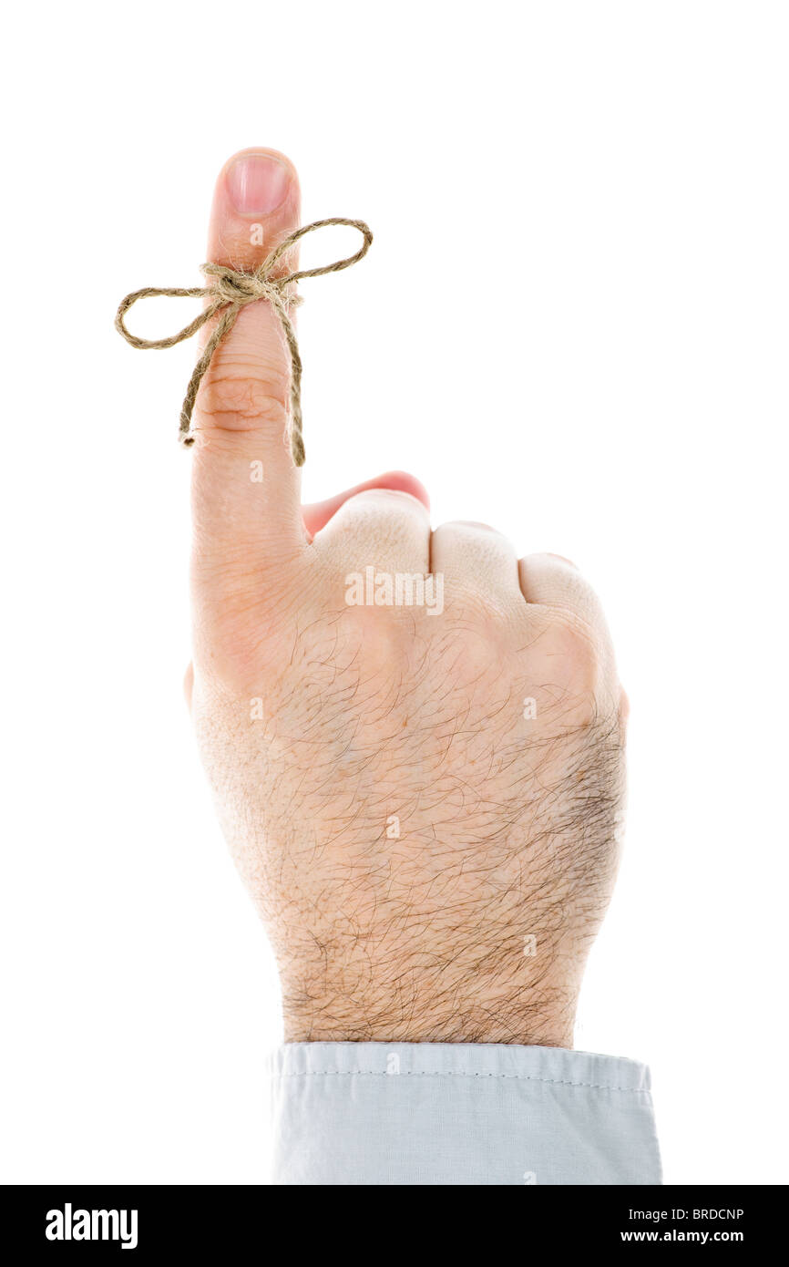 String tied on finger as reminder isolated on white background Stock Photo
