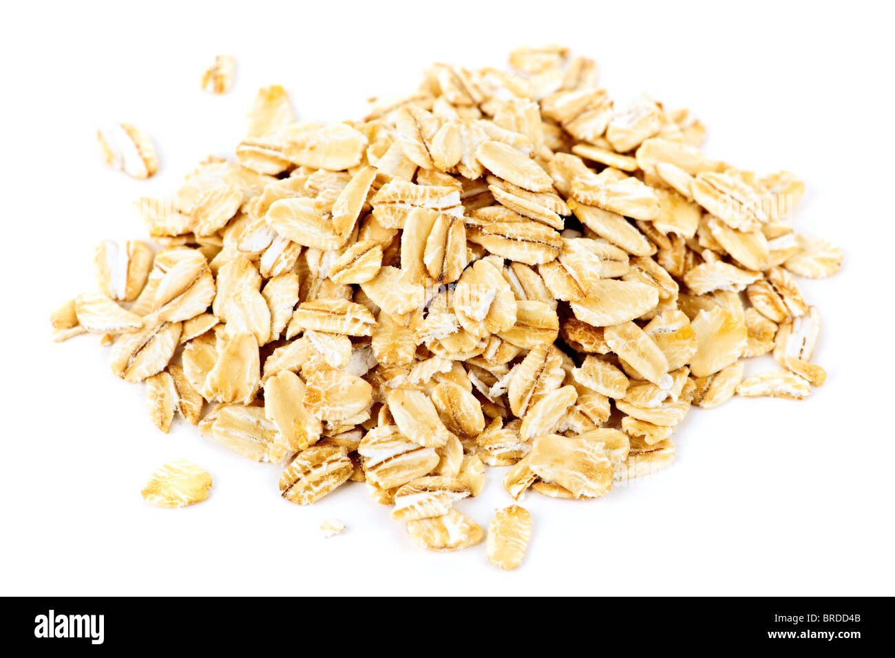 Heap of dry rolled oats isolated on white background Stock Photo