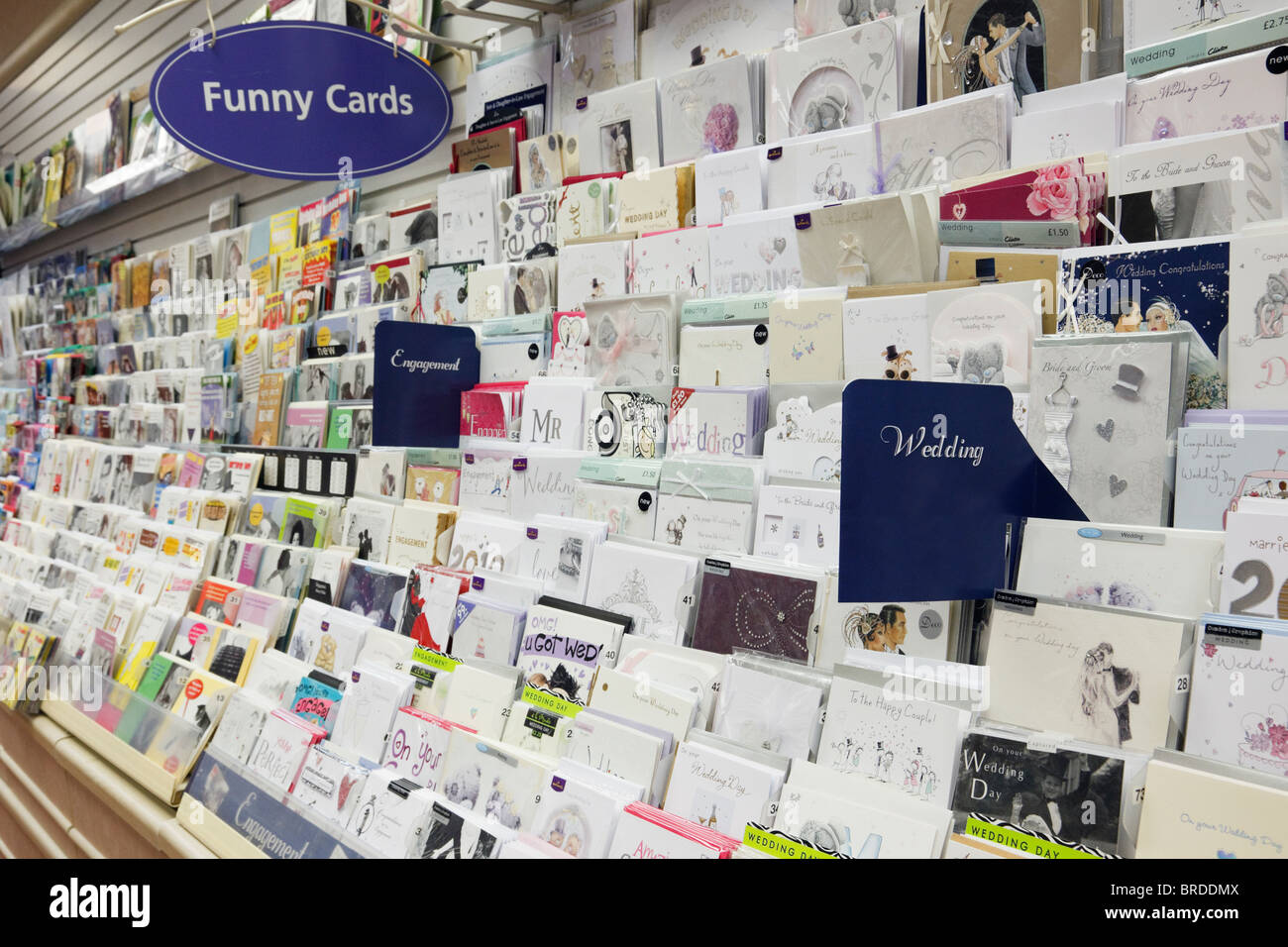 Selection of wedding and engagement Greeting cards for sale on a display stand inside Clintons card shop. England, UK, Britain Stock Photo