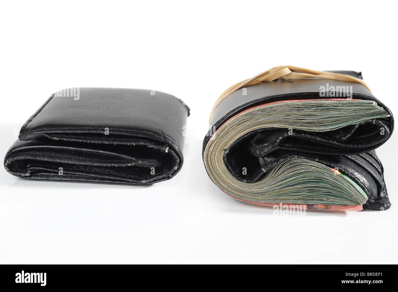 Empty and full wallet on white background Stock Photo