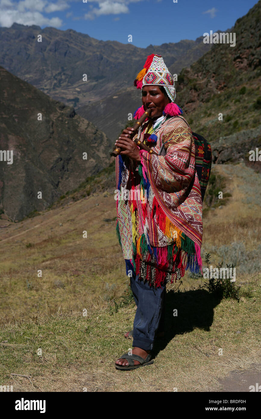 Native Peruvian Indian Playing Recorder-like Wind Instrument At Pisac 