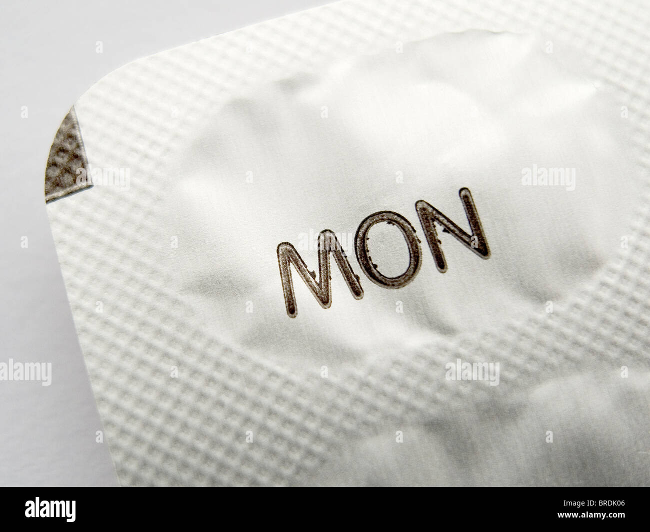 Daily drug dose packaging labeled MON (Monday) Stock Photo