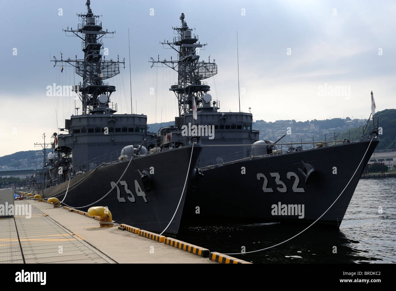 Warships of Japanese Maritime Self Defense Force anchored along the shore in Sasebo, Japan. 19-Sep-2010 Stock Photo