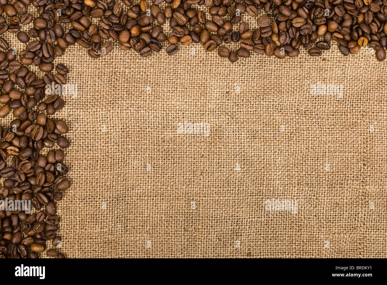 Coffee beans and sackcloth background Stock Photo