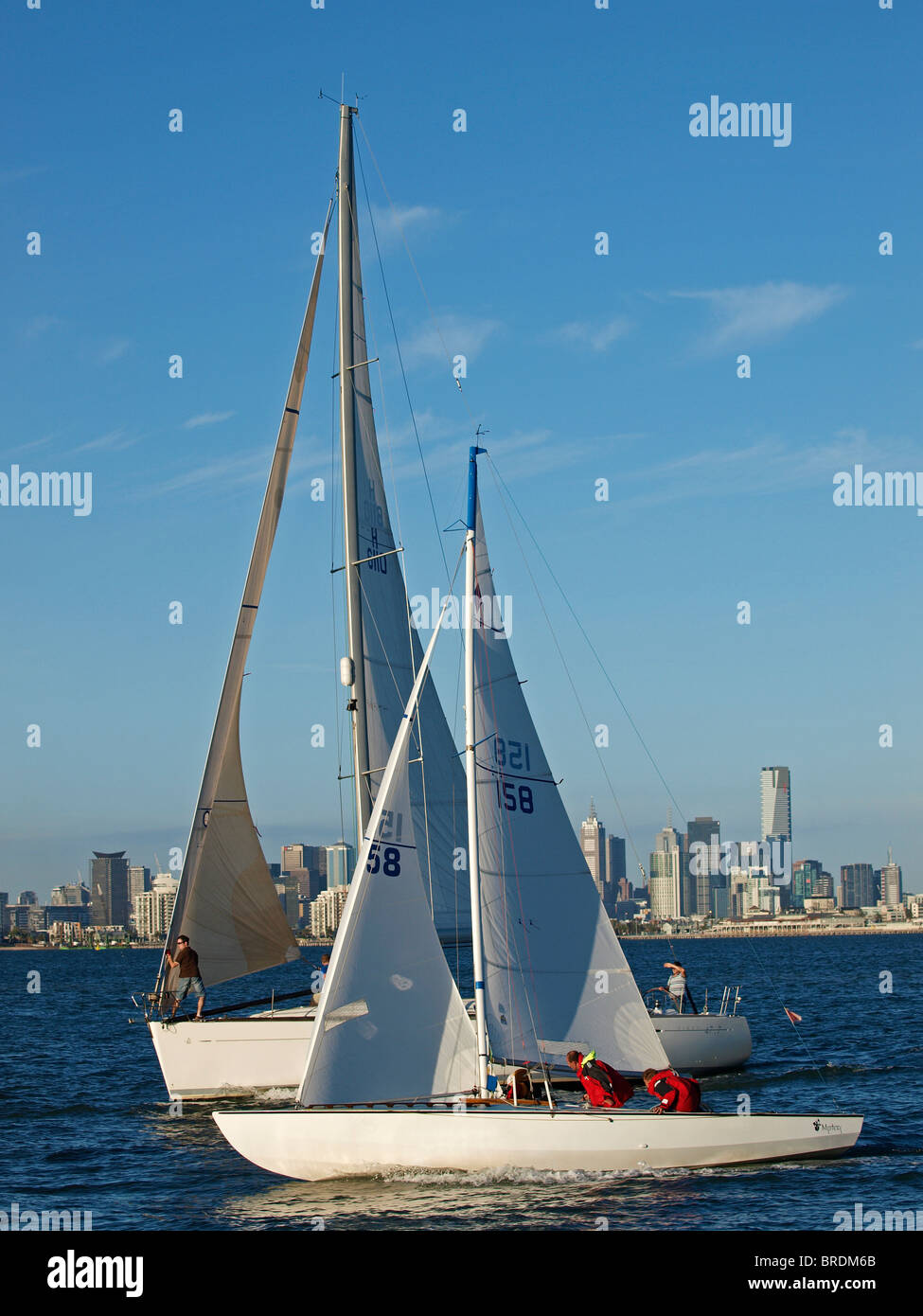 SAILING BOAT TAKING PART IN EVENING RACING ON PORT PHILLIP BAY