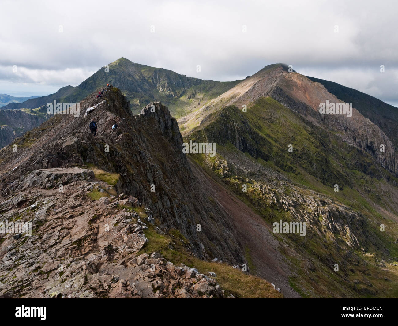 The arete of Crib Goch, a famous ridge traverse in Snowdonia forming the first section of the Snowdon Horseshoe ridge walk Stock Photo