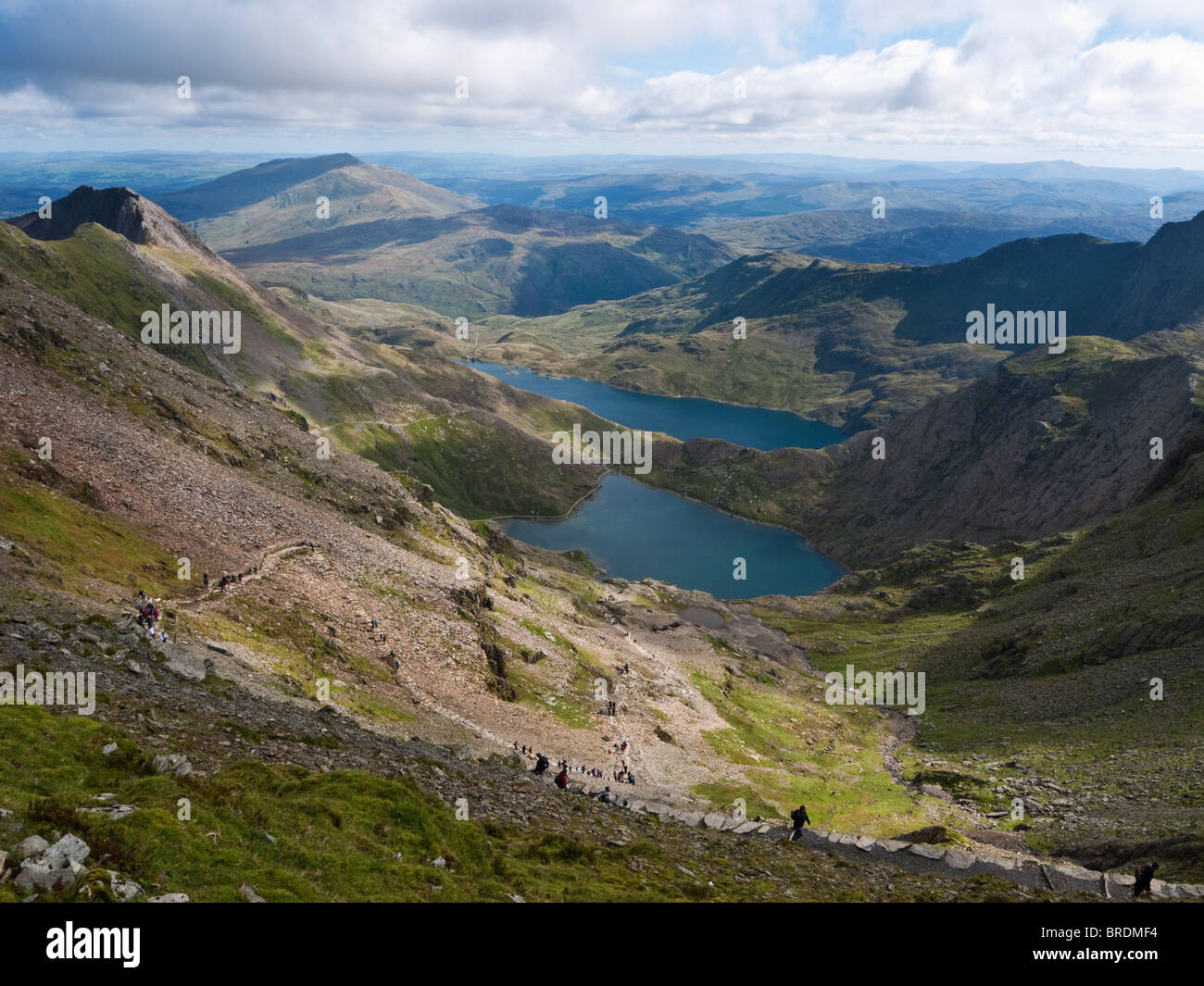 The view down Cwm Dyli from near the top of Snowdon, showing the zig-zags of the Pyg Track, Crib Goch, Glaslyn and Llyn Llydaw Stock Photo