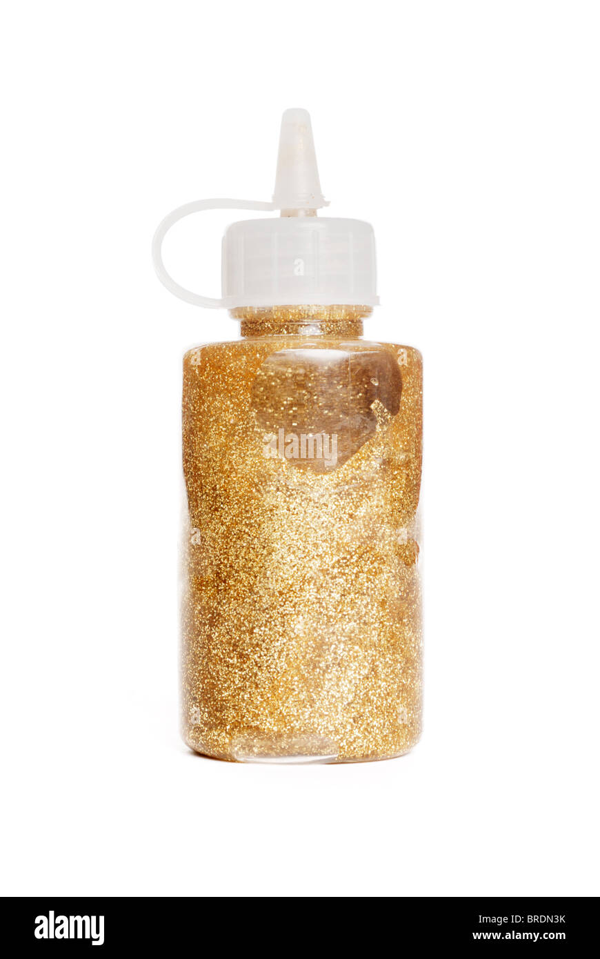 Gold glitter in container Stock Photo
