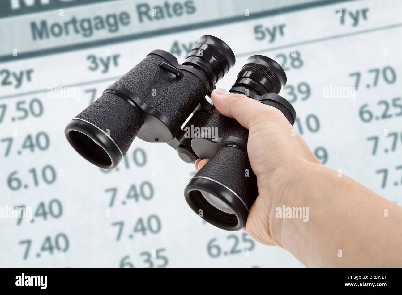 Binoculars and Mortgage Rates, concept of Business success Stock Photo