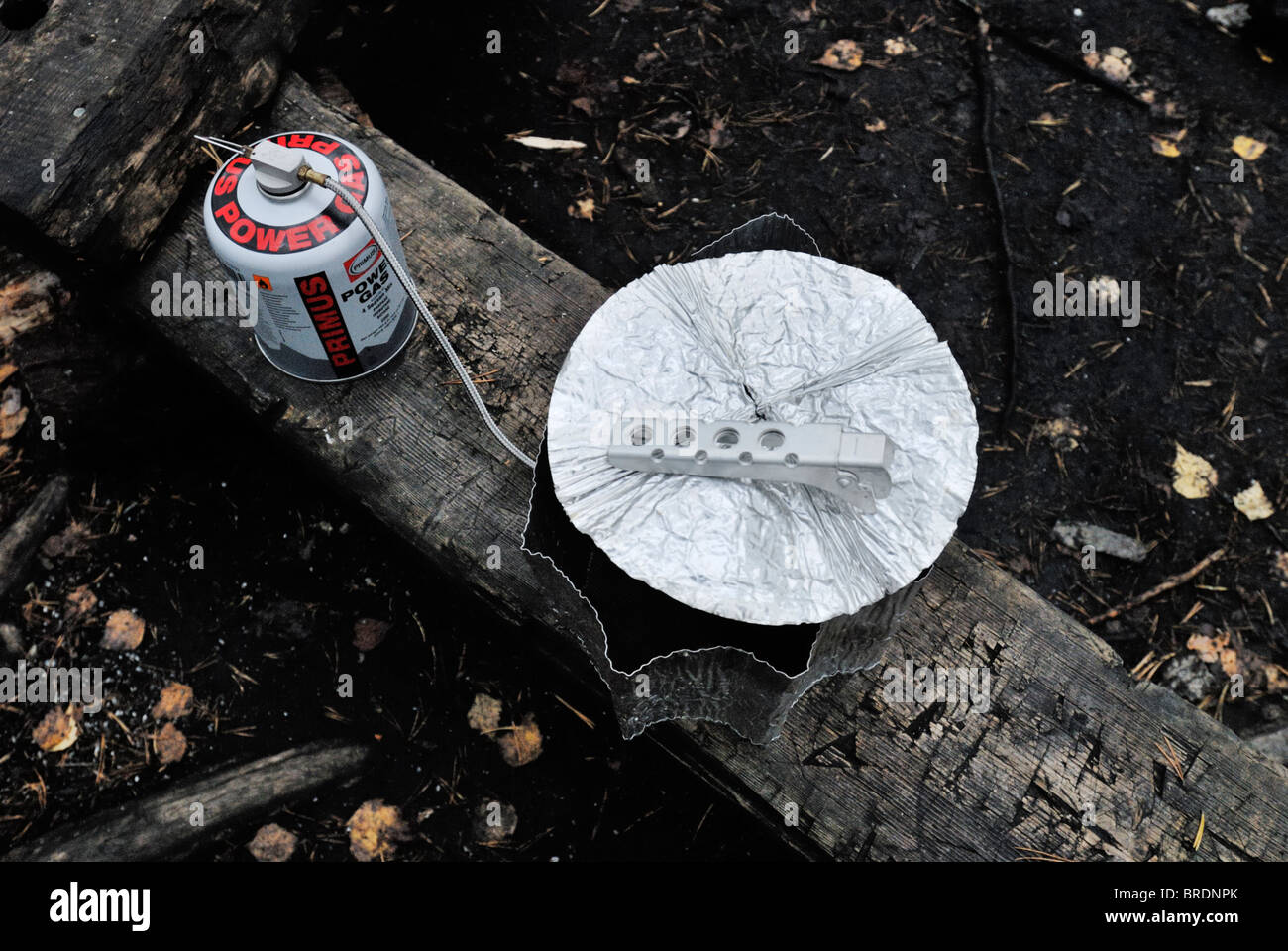 Cooking with portable gas stove. Lightweight foldable aluminum cover