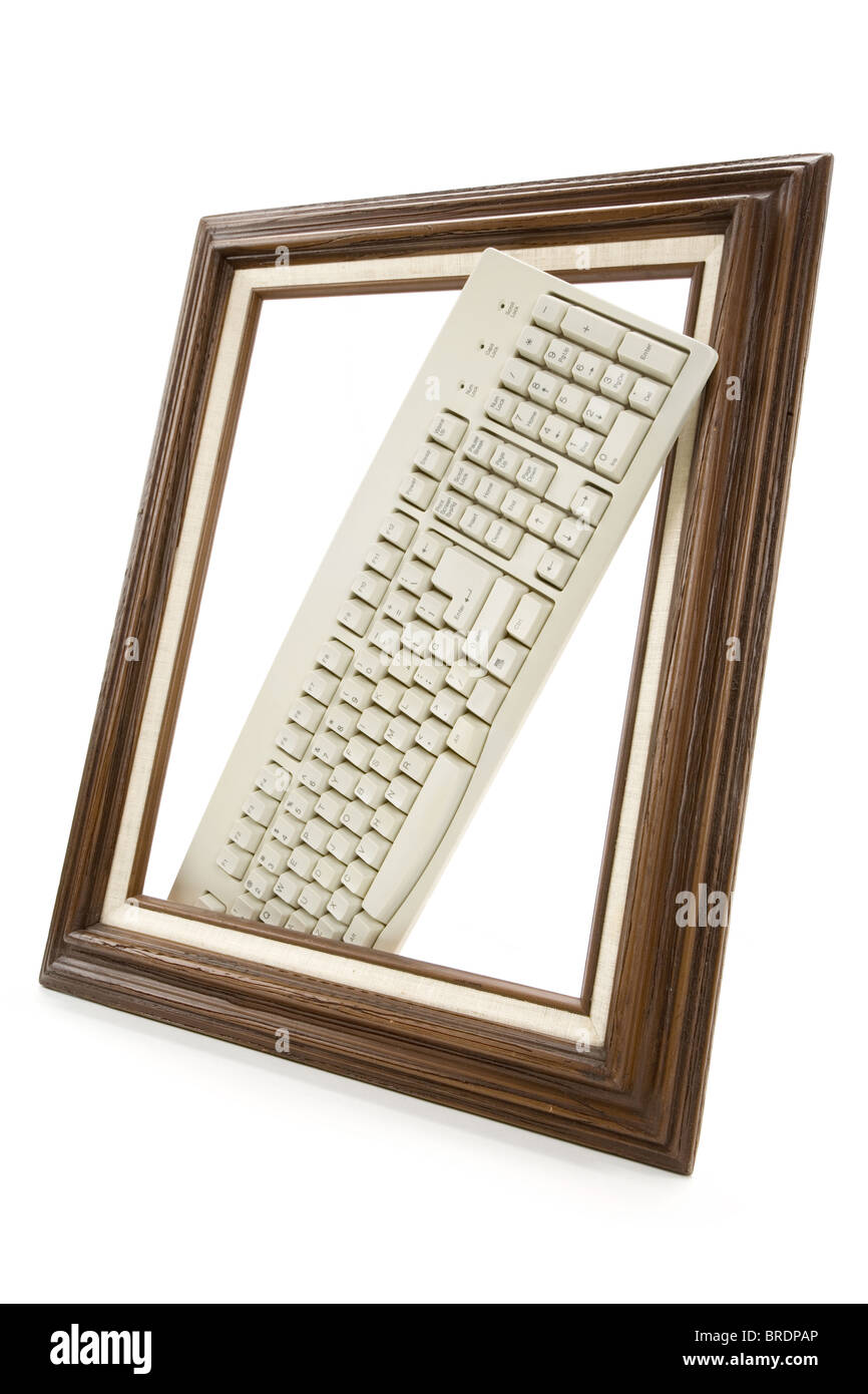 Wood Picture Frame and computer keyboard, concept of digital art produce Stock Photo