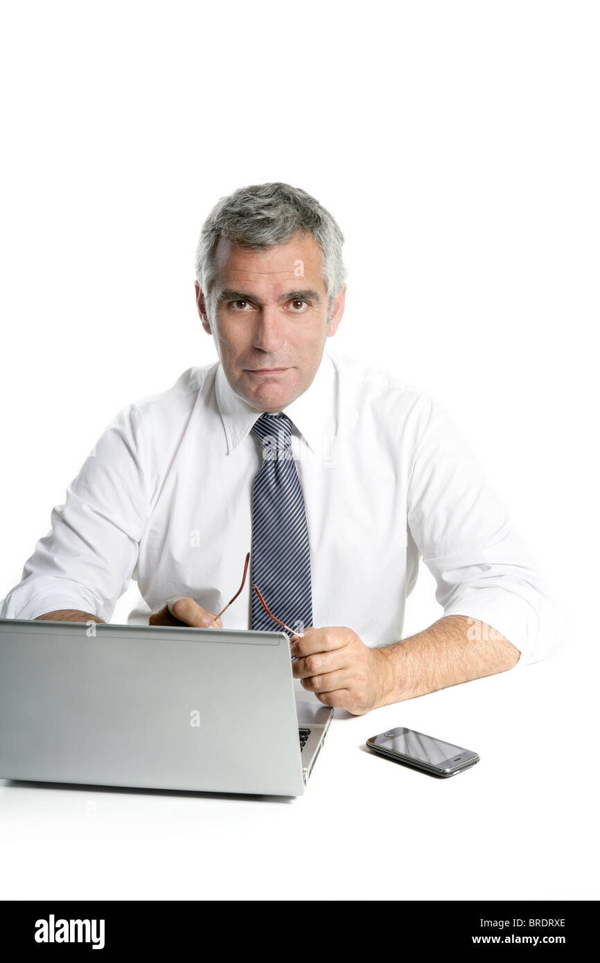 businessman senior gray hair working laptop computer white desk background Stock Photo