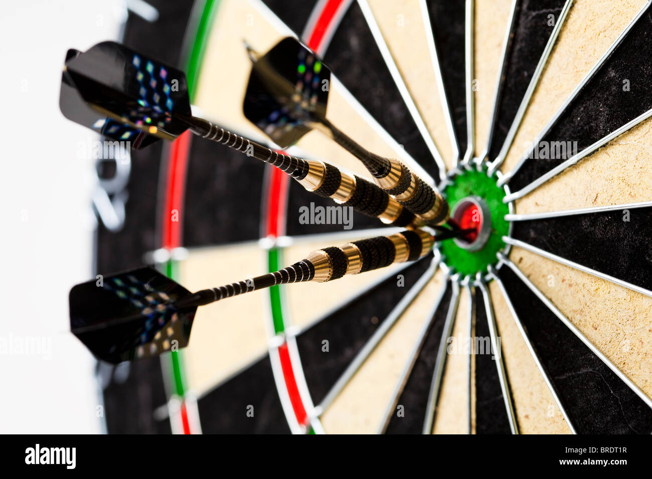 Darts in bull'seye Stock Photo Alamy
