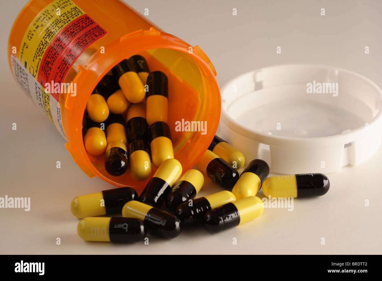 Prescription Drugs & Bottle - Antibiotic Capsules Stock Photo