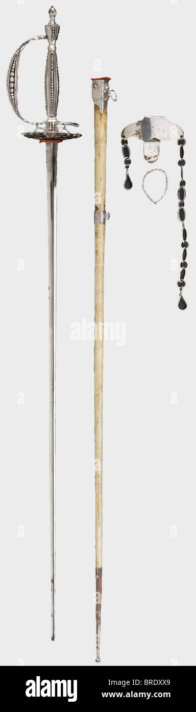 An English cut-steel sword with scabbard, circa 1810 Smooth triangular blade (the extreme point is missing). Openwork cut-steel hilt set with faceted spheres (one bead ring from the guard plate is loose but present). Sharkskin-covered wooden scabbard with steel mountings (chape rust covered), and attached chain and belt hook. Length 107 cm. historic, historical, 19th century, dress sword, swords, thrusting, thrustings, smallsword, epee de cour, weapon, arms, weapons, arms, military, militaria, object, objects, stills, clipping, clippings, cut out, cut-out, cut-, Stock Photo