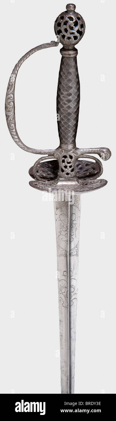 A small-sword with chiselled hilt, Germany(?), circa 1780 Hollow triangular thrusting blade with ornamental etching at the forte. Openwork iron hilt with a vine-shaped pattern and a faceted steel grip. Length 97.5 cm. historic, historical, 18th century, dress sword, swords, thrusting, thrustings, smallsword, epee de cour, weapon, arms, weapons, arms, military, militaria, object, objects, stills, clipping, clippings, cut out, cut-out, cut-outs, Stock Photo