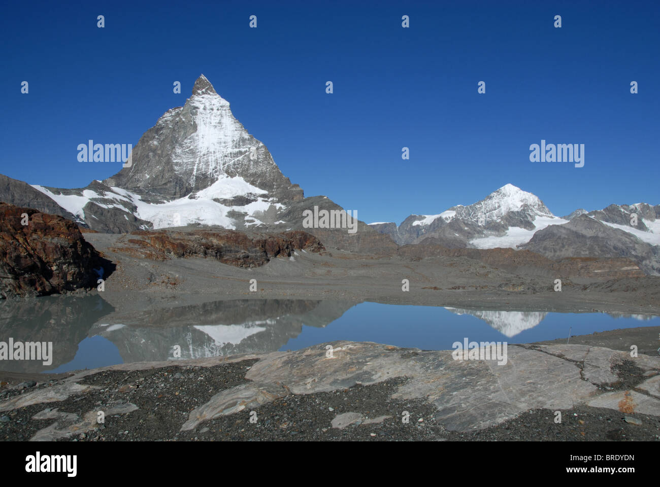 Materhorn and Dent Blanche reflection in lake at Trockener Steg, Glacier trail, Zermatt, Switzerland Stock Photo