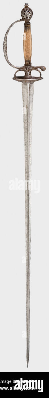 A French small-sword with chiselled hilt, circa 1760 Tapering triangular thrusting blade with remnants of etching at the forte. Openwork iron hilt chiselled with floral designs and with a rectangular wooden grip (cover missing). Length 96 cm. historic, historical, 18th century, dress sword, swords, thrusting, thrustings, smallsword, epee de cour, weapon, arms, weapons, arms, military, militaria, object, objects, stills, clipping, clippings, cut out, cut-out, cut-outs, Stock Photo