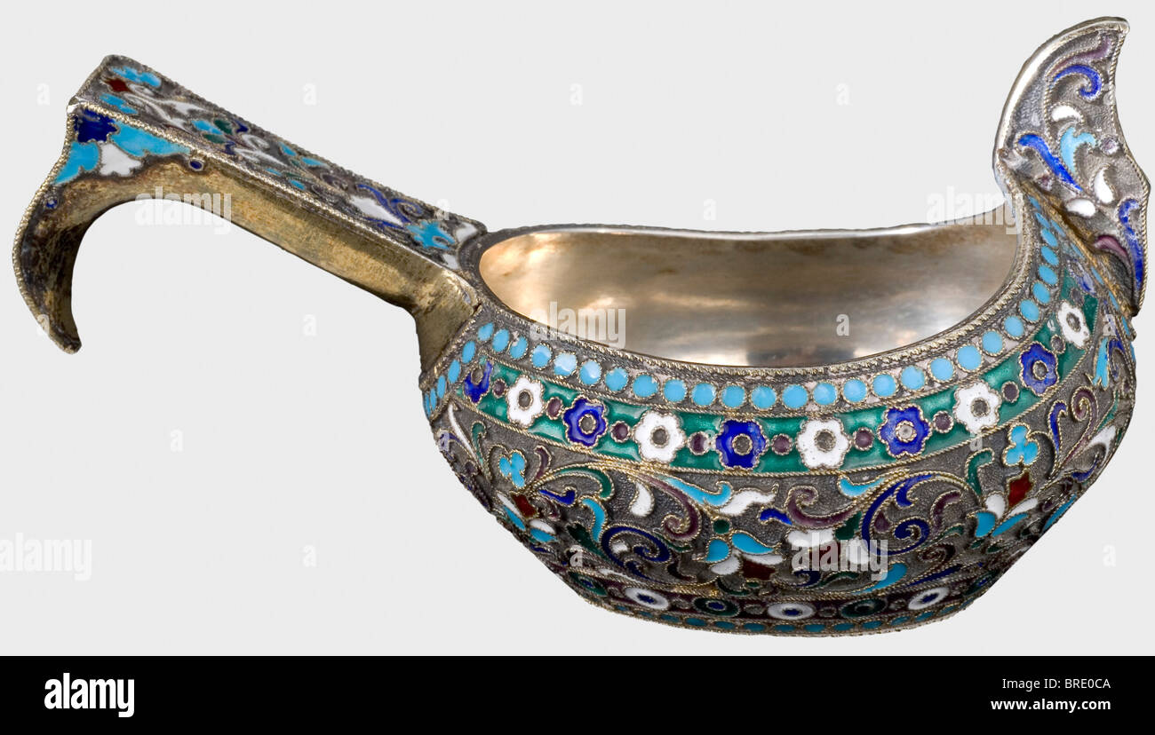 A silver cloisonné kovsch, Moscow, circa 1910 Cyrillic master's mark 'MZ'. Silver, partially gilt, and filigree, floral enamel work. Moscow hallmark for '84' zolotniki. Weight 93 g. Length 105 mm. Provenance: Grand Duchess Vera Konstantinovna Romanova (1854 - 1912). historic, historical, 1910s, 20th century, vessel, vessels, object, objects, stills, clipping, clippings, cut out, cut-out, cut-outs, Stock Photo