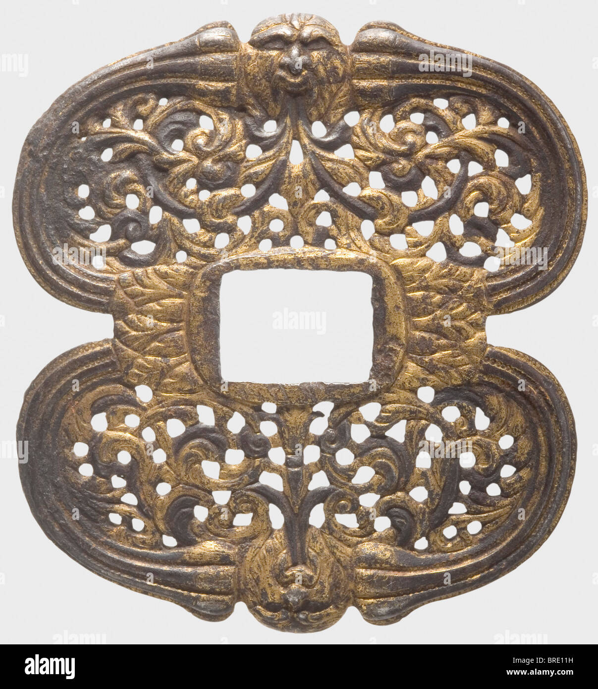 A French double shell-guard for a small-sword, circa 1740 Gilt iron guard with openwork floral designs and chiselled with grotesque masks on the rims on both sides. Width 6.7 cm. historic, historical, 18th century, dress sword, swords, thrusting, thrustings, smallsword, epee de cour, weapon, arms, weapons, arms, military, militaria, object, objects, stills, clipping, clippings, cut out, cut-out, cut-outs, Stock Photo