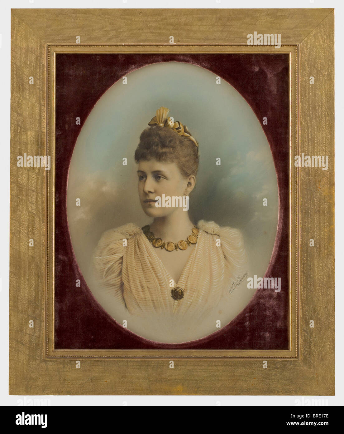 A portrait of the Grand Duchess Alexandra Georgijevna (1870 - 1891), a coloured, vertically oval photograph With the ink signature of the court photographer, "A. Pasetti, St. Petersbourg" on the right edge. In a gilt wooden frame, under glass, in wine red velvet passepartout, picture dimensions 6.5 x 42.5 cm, framed dimensions 77.5 x 65.3 cm. Label on the back, "H.V.v.W. G.v.R. Privateigentum No. 444" for the Duchess Vera of Württemberg, Grand Duchess of Russia. Alexander Ivanovich Pasetti studied at the St. Petersburg Art Academy and won a silver medal there i, Stock Photo