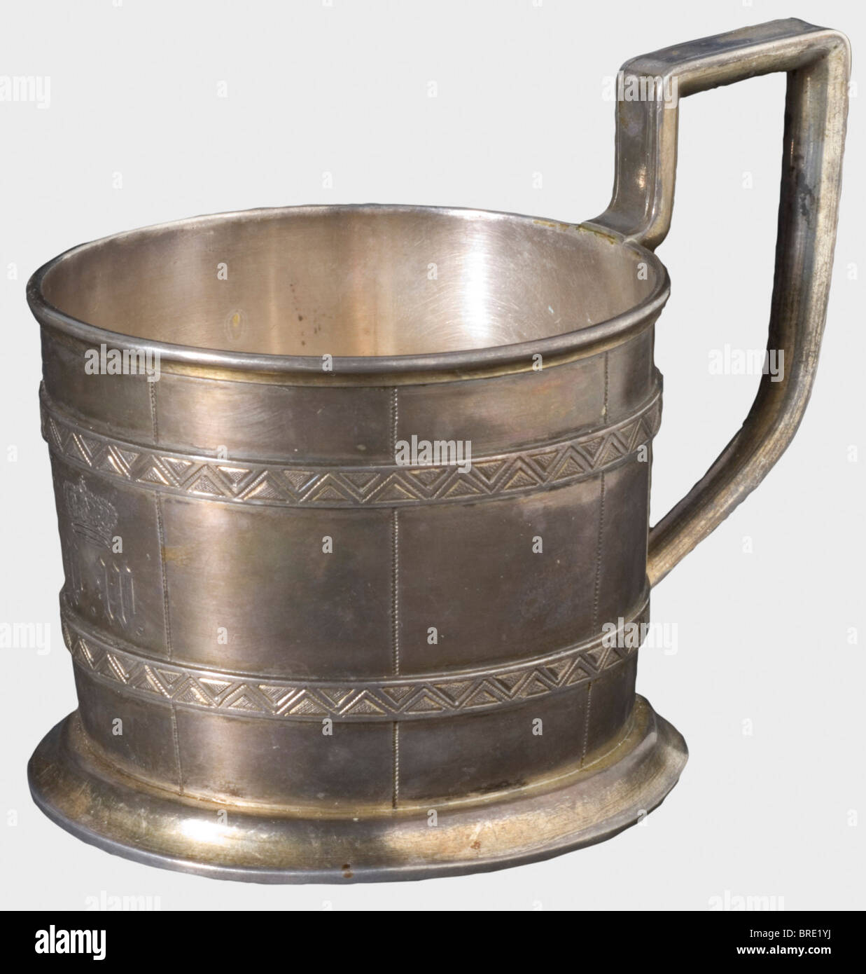 A silver holder for a tea glass, St. Petersburg, 1874 Silver, made in the shape of a cask. The master's mark 'AL', '84' hallmark, and the St. Petersburg inspection mark with the year '1874' are on the bottom. Height 8.5 cm. Weight 141 g. The monogram 'FW' beneath a crown is displayed on the front, so presumably it was a gift to/from Duke Friedrich Wilhelm von Württemberg (1802 - 1881). Provenance: Grand Duchess Olga Nikolaevna Romanova (1822 - 1892). historic, historical, 19th century, object, objects, stills, clipping, clippings, cut out, cut-out, cut-outs, Stock Photo