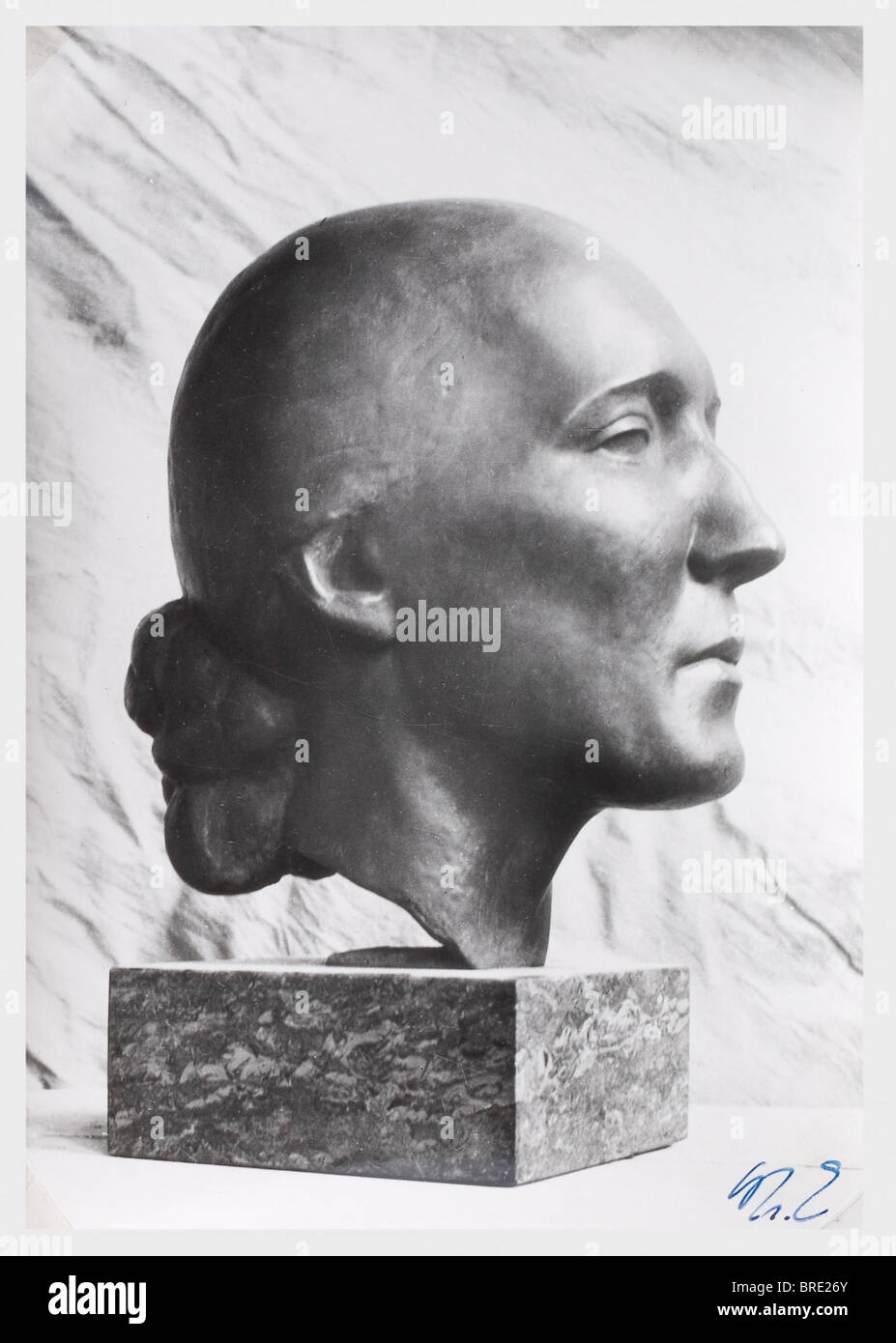 Professor Kurt Schmid-Ehmen (1901 - 1968), the portrait head 'Frau Helmerich' Life-size female bronze head on grey granite base. Signed on the left side of the neck 'Schmid-Ehmen W 1933', the base marked with the foundry name 'Preissmann Bauer & Co. München'. With a half portrait photo of the head bearing the artist's ink paraph. Height 29 cm, base 7 cm. The work was originally titled 'Frau Helmerich', in an exhibition held in 1991 in commemoration of the artist's 100th birthday, however, it was presented as 'Mita'. Also included is a copy of a letter, Artist's Copyright has not to be cleared Stock Photo