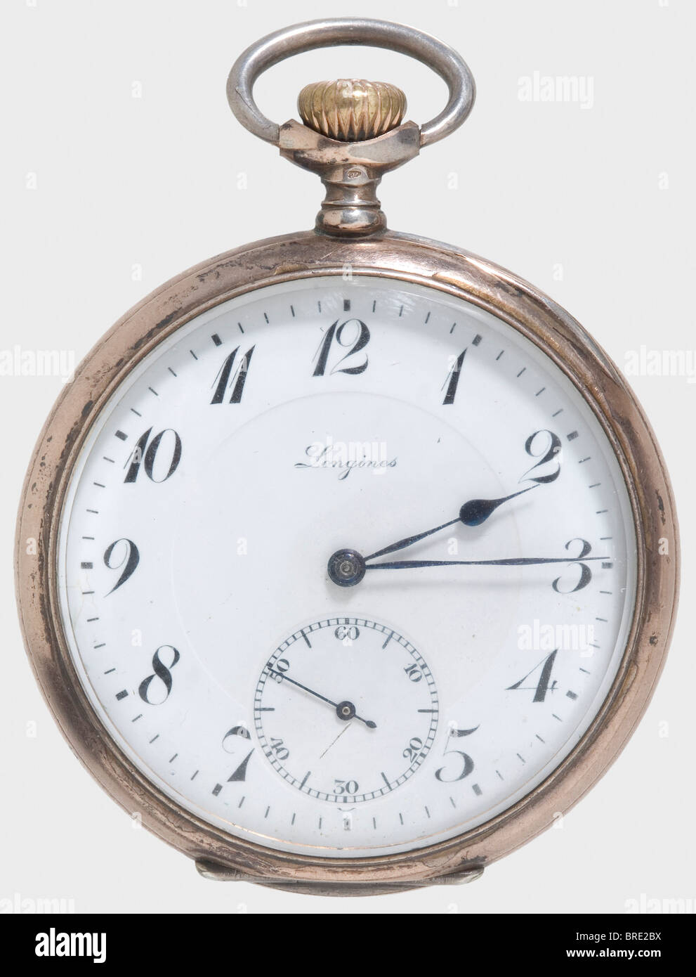 Kaiser Wilhelm II, a presentation watch for 25 years of service A silver pocket watch made by 'Longines' with rose gold-plated rims. White enamel dial with Arabic numerals, small second at the '6' position, and blued steel hands. The lid bears a 'W' cipher beneath an imperial crown and is engraved on the inside with: 'Für 25jährige treue Dienste dem Former August Müller - Kgl. Geschossfabrik in Spandau - 3.7.16'. (For 25 years loyal service, to the Moulder, August Müller - Royal Munitions Factory in Spandau - 3 July 1916). The outer lid bears a of the Kaiser in, Stock Photo