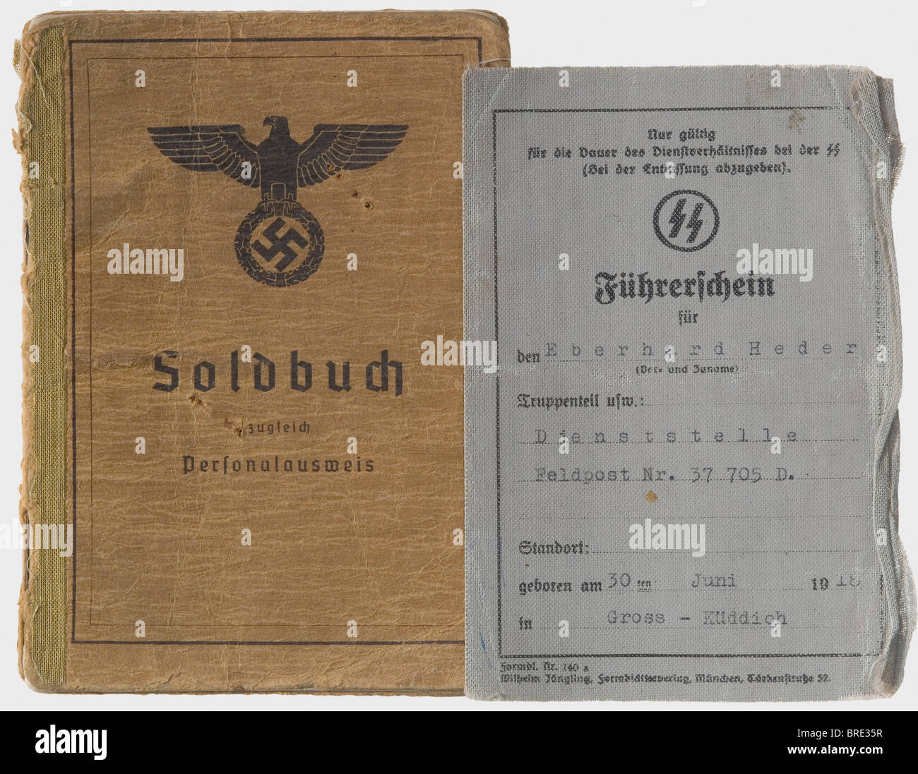 Knight's Cross Winner SS-Sturmbannführer Eberhard Heder, his Soldbuch and driver's license The Identity/Pay Book (Army Type) issued 15 June 1943 by SS-Pioneer Battalion 5 of SS-Panzer Division 'Wiking' and signed in places by Hugo Eichhorn. Many entries, among which are awards of the Iron Cross 1st and 2nd Class, the Infantry Assault Badge, the German Cross in Gold on 15 March 1944 (as commander of the 'Narva' Battalion of Estonian volunteers), the Knight's Cross of the Iron Cross on 23 November 1944 (as commander of Pioneer Battalion 5 of 'Wiking' Division for, Stock Photo