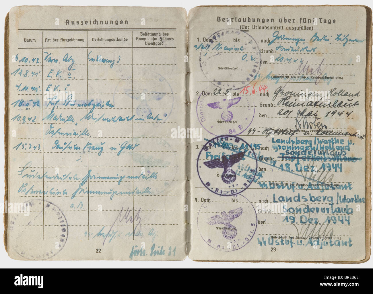 Knight's Cross Winner SS-Sturmbannführer Eberhard Heder, his Soldbuch and driver's license The Identity/Pay Book (Army Type) issued 15 June 1943 by SS-Pioneer Battalion 5 of SS-Panzer Division 'Wiking' and signed in places by Hugo Eichhorn. Many entries, among which are awards of the Iron Cross 1st and 2nd Class, the Infantry Assault Badge, the German Cross in Gold on 15 March 1944 (as commander of the 'Narva' Battalion of Estonian volunteers), the Knight's Cross of the Iron Cross on 23 November 1944 (as commander of Pioneer Battalion 5 of 'Wiking' Division for, Stock Photo
