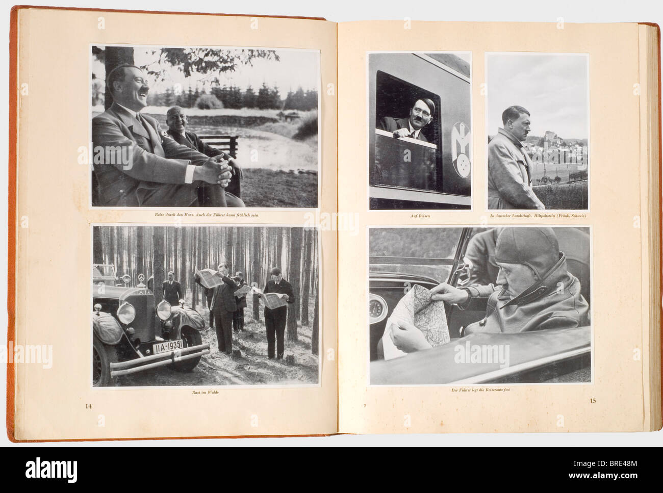 Adolf Hitler, a personal copy of the illustrated book 'Adolf Hitler' 'Adolf Hitler - Bilder aus dem Leben des Führers', ed. Cigarette/Picture Service Altona/Bahrenfeld 1936. The last page with the inscription 'Three hundred copies of the 'Adolf Hitler' book published by F.A. Brockhaus, Leipzig, were bound in real saffian leather. This copy bears the number '1'' (transl.). On the inside of the cover the ex libris 'Adolf Hitler', on the flyleaf the handwritten ink signature 'Martin Bormann Obersalzberg 26.7.36'. Incl. dust jacket. De luxe edition in gold-embossed, Stock Photo