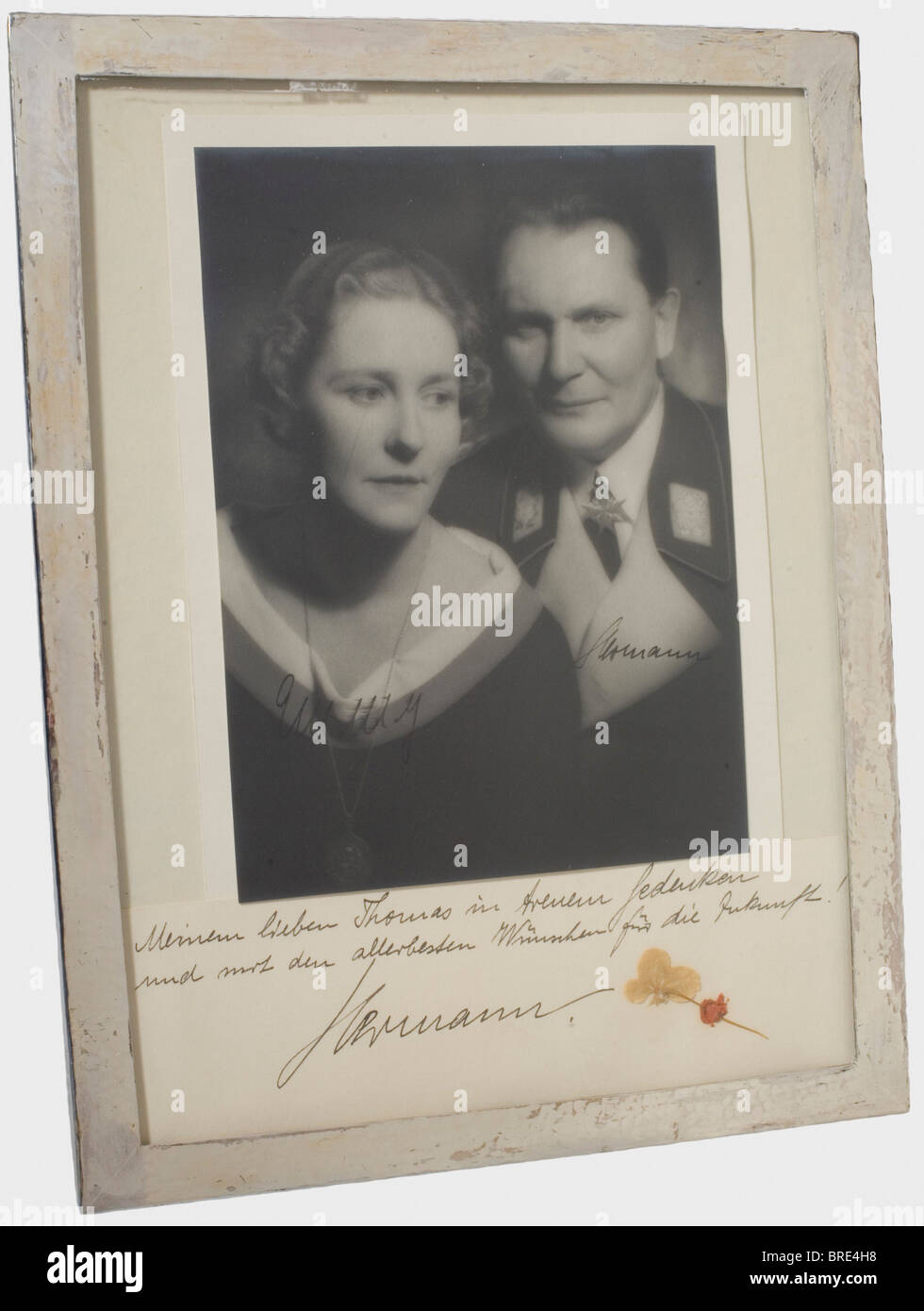Hermann and Emmy Göring, a dedication photograph to Thomas von Kantzow Half portrait of Hermann Göring in the uniform of an air force general with Pour le mérite. Handwritten signatures in dark ink 'Hermann' and 'Emmy', behind the picture an inserted paper with a dried four-leaf clover and the handwritten dedication of Hermann Göring 'To my dear Thomas in fond memory and with all the best wishes for the future! Hermann'. In a standing picture frame made of hammered silver, from the studio of Hermann Göring's favourite Berlin jeweller, Professor Herbert Zeitner,, Stock Photo