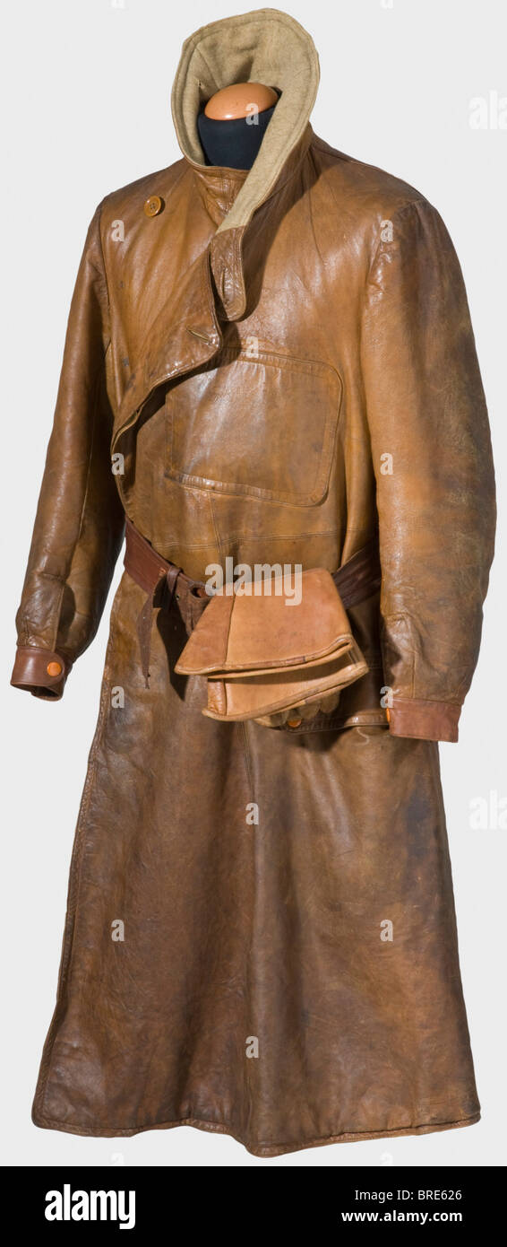 A brown leather flight suit for an English pilot, Royal Flying Corps, ca. 1915 A flying helmet, partially lined with brown fur, ear flaps fasten with press snaps. Inscribed inside, 'FLIGHT 190912 C.P.O. Cole' Flying goggles backed with fur. Safety glasses in brown non-ferrous metal frames. Maker's inscription, 'Triplex Safety Glass STC Aero Mask'. Rubber strap aged. A coat, light-coloured wool lining, sleeve closure with press snaps. Button flap. The brown buttons removed but present. Angled pocket on the chest. Leather belt with leather covered buckle. Worn, s, Stock Photo