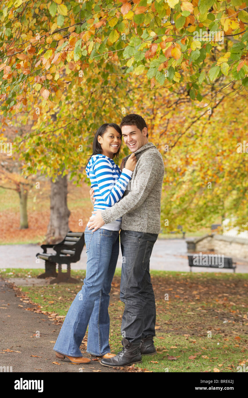 Romantic Teenage Couple In Autumn Park Stock Photo