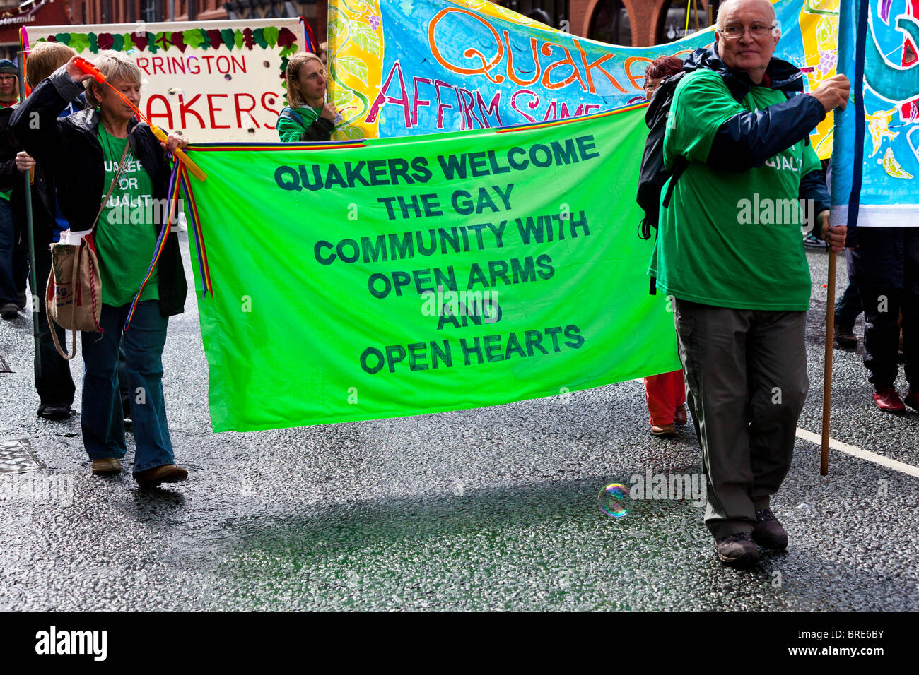 Quakers with banner gay pride march Stock Photo
