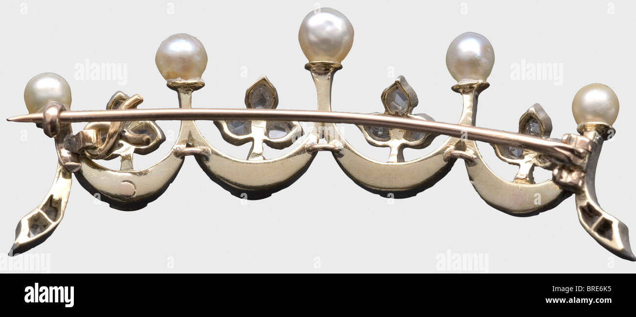A diadem-brooch with diamonds and Oriental pearls, circa 1900. Silver and partially gilt. Diamonds in Old European cut, diamond chips, and five pearls. In an old, non-matching case. According to the copy of the receipt with it, it was a gift from the House of Romanov for services rendered. historic, historical, 1900s, 20th century, 19th century, object, objects, stills, clipping, clippings, cut out, cut-out, cut-outs, fine arts, art, art object, art objects, artful, precious, collectible, collector's item, collectibles, collector's items, rarity, rarities, Stock Photo