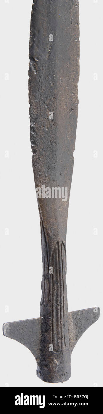 A German winged lance, 9th/10th century Broad, lightly ridged blade. The polygonal socket is surrounded with decorative grooves. Side bars are good quality restorations. Two attachment holes on the lower edge of the socket. Length 47.5 cm. Beautiful, typical cavalry weapon of the early Middle Ages. An almost identical piece in: Müller/Kölling, 'Europäische Hieb und Stichwaffen', fig. no. 62. historic, historical, 10th century, 9th century, pole weapon, weapons, arms, weapon, arm, fighting device, military, militaria, object, objects, stills, clipping, clippings, Stock Photo