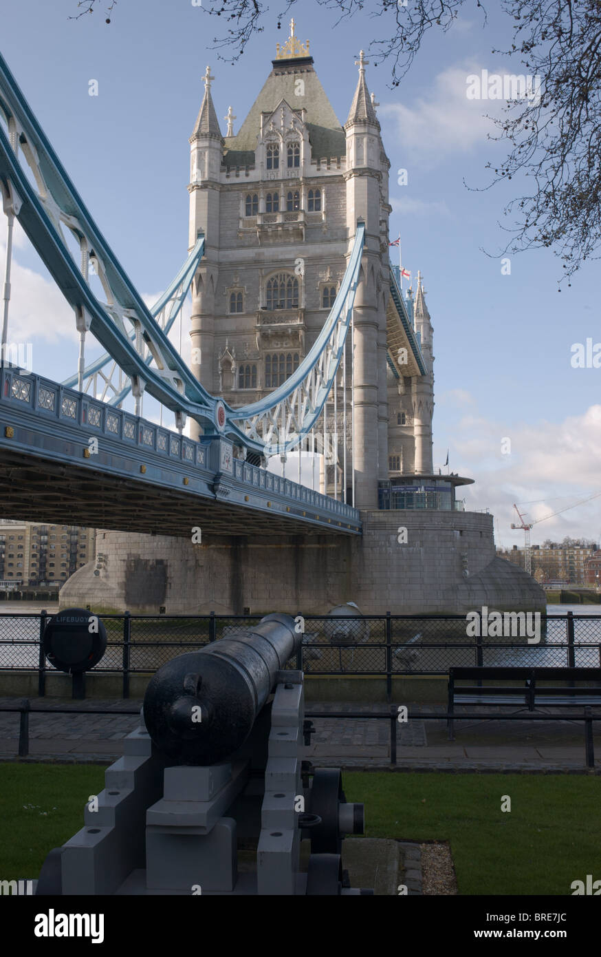 Tower Bridge and cannon from the grounds of the Tower of London, London, England, UK. Stock Photo