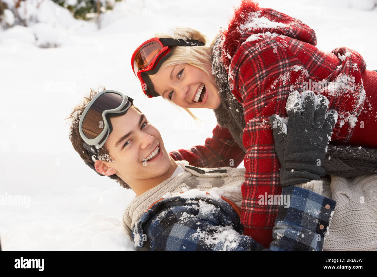 Romantic Teenage Couple Having Fun In Snow Stock Photo