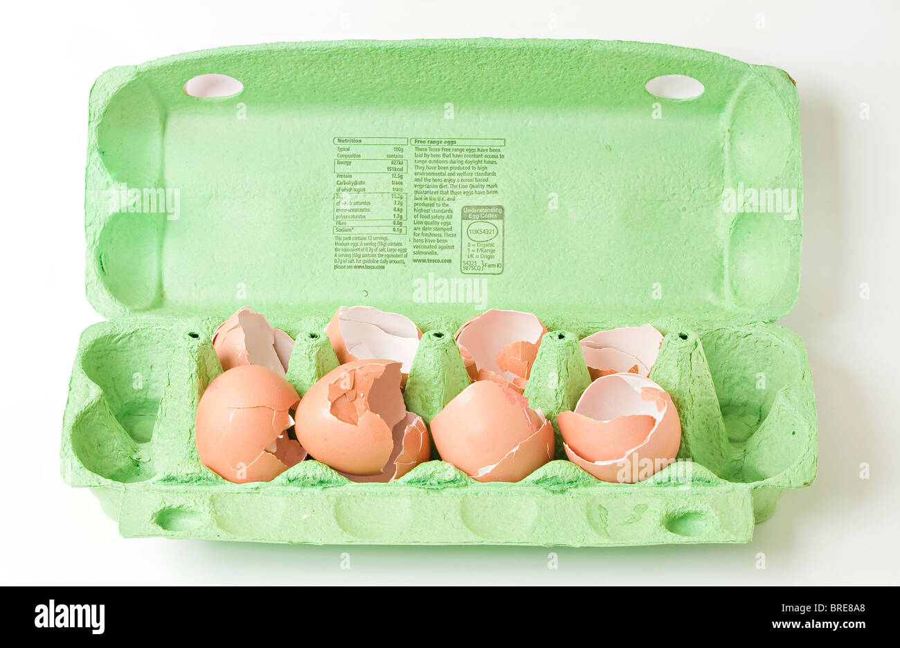 A carton with broken eggs Stock Photo Alamy